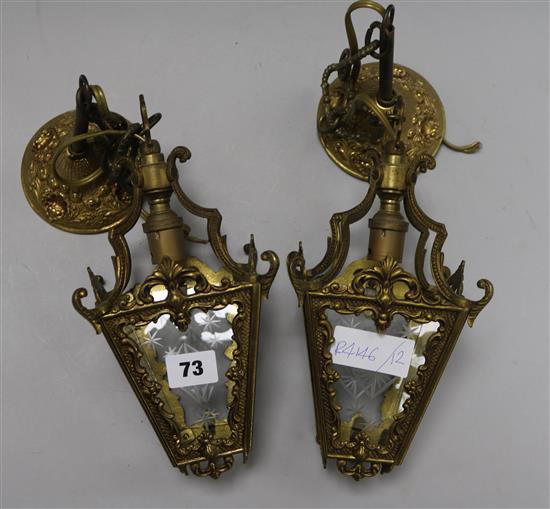 A pair of etched glass and brass hall lanterns